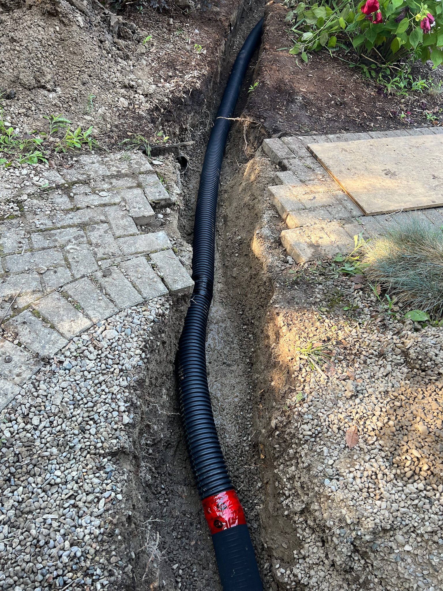 French drain solution under interlocking brick walkway in London, Ontario French drain solution under interlocking brick walkway in London, Ontario